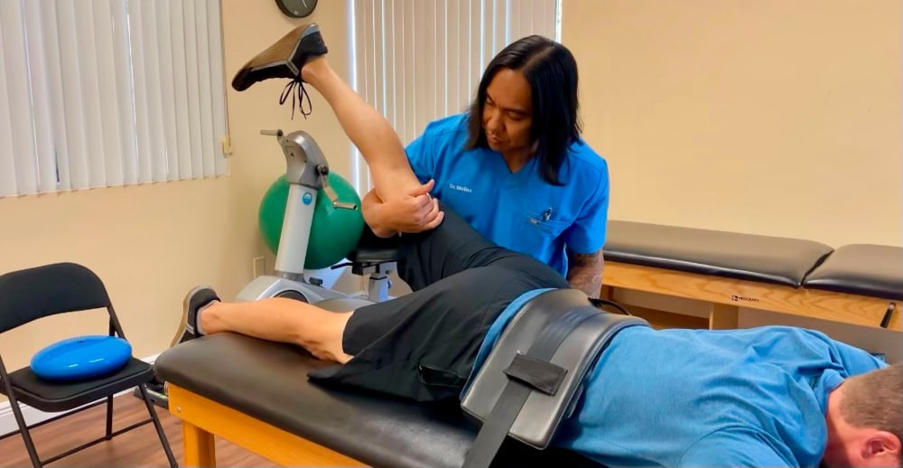 Dr. Molina working on functional restoration and physical Therapy