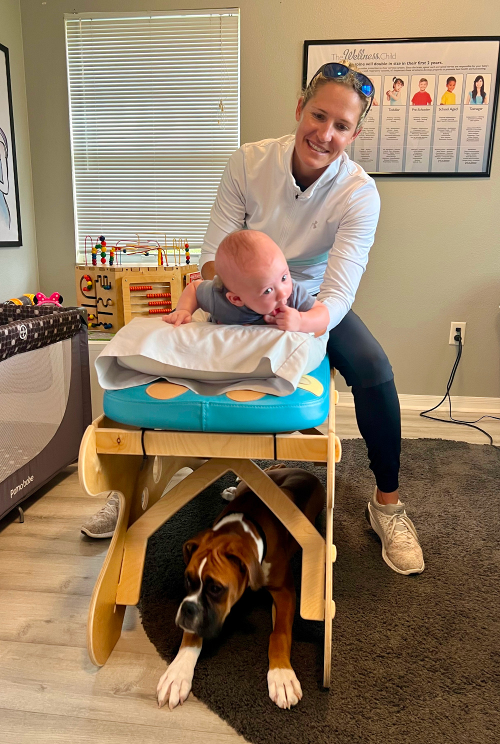 Dr. Danielle Adjusting baby boy on pediatric adjustment table