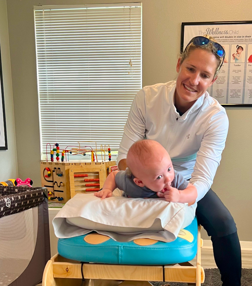 Dr.-Danielle-Adjusting-baby-boy-on-pediatric-adjustment-table-short