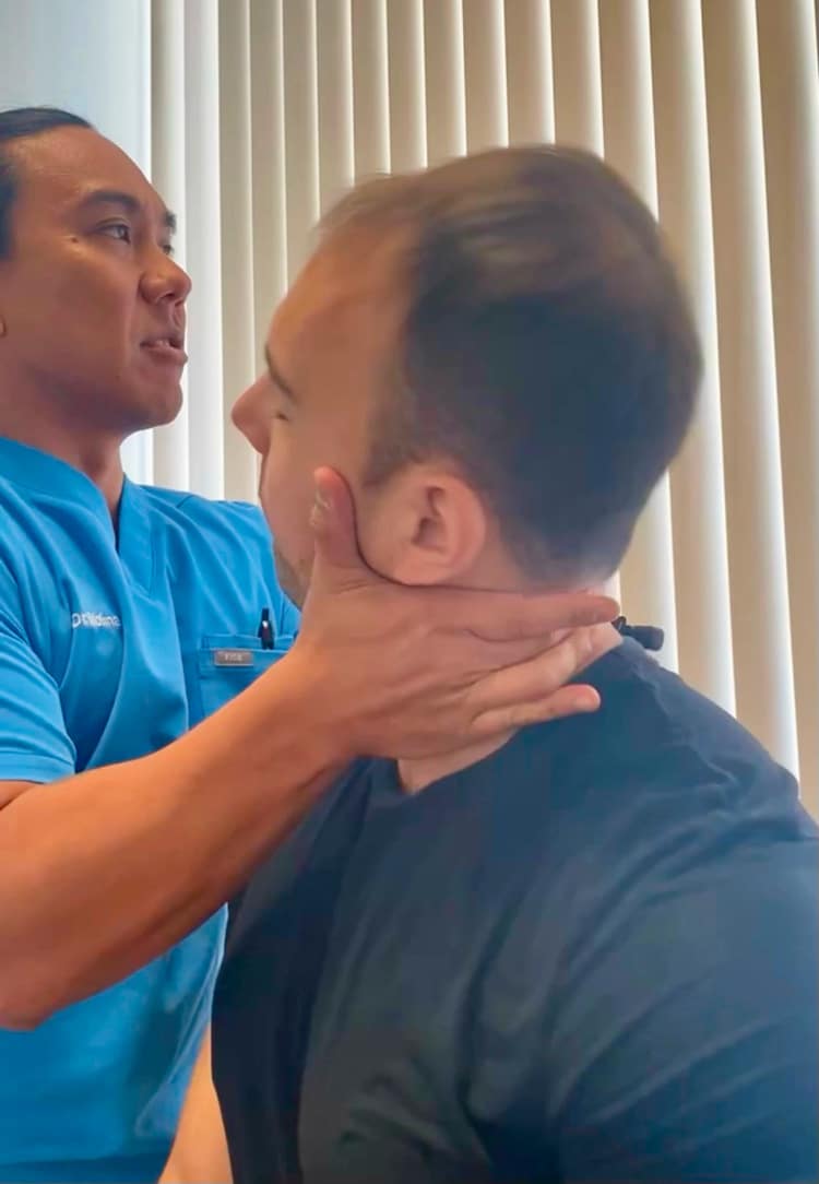 Dr. Alan treating a patient for headaches and migraines