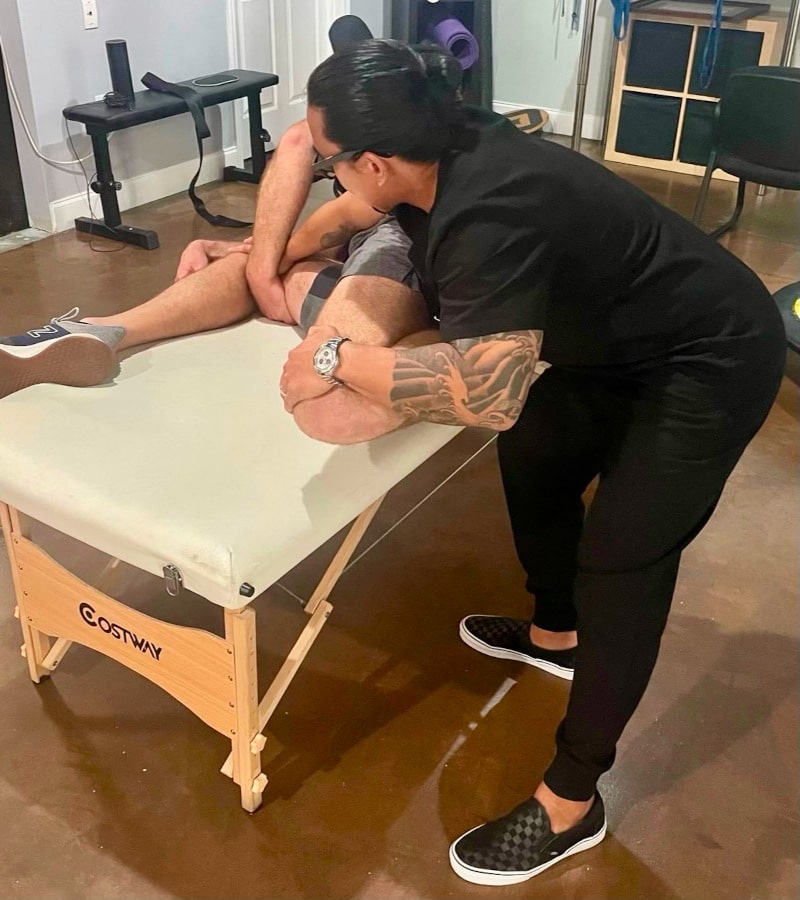 Dr. Alan Molina adjusting a patient