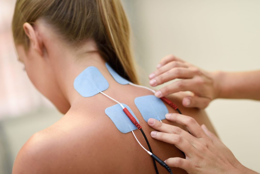Tens Therapy relieving neck pain at Optilife in Tampa, FL